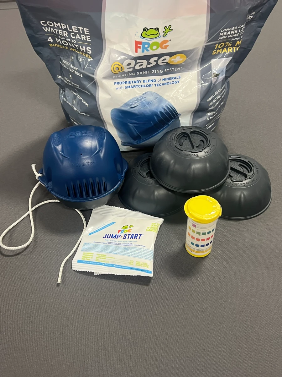 FROG @ease+ bundle contents - mineral cartridge, 4 SmartChlor+ 200g cartridges, test strips, Jump Start shock packet and cord tether
